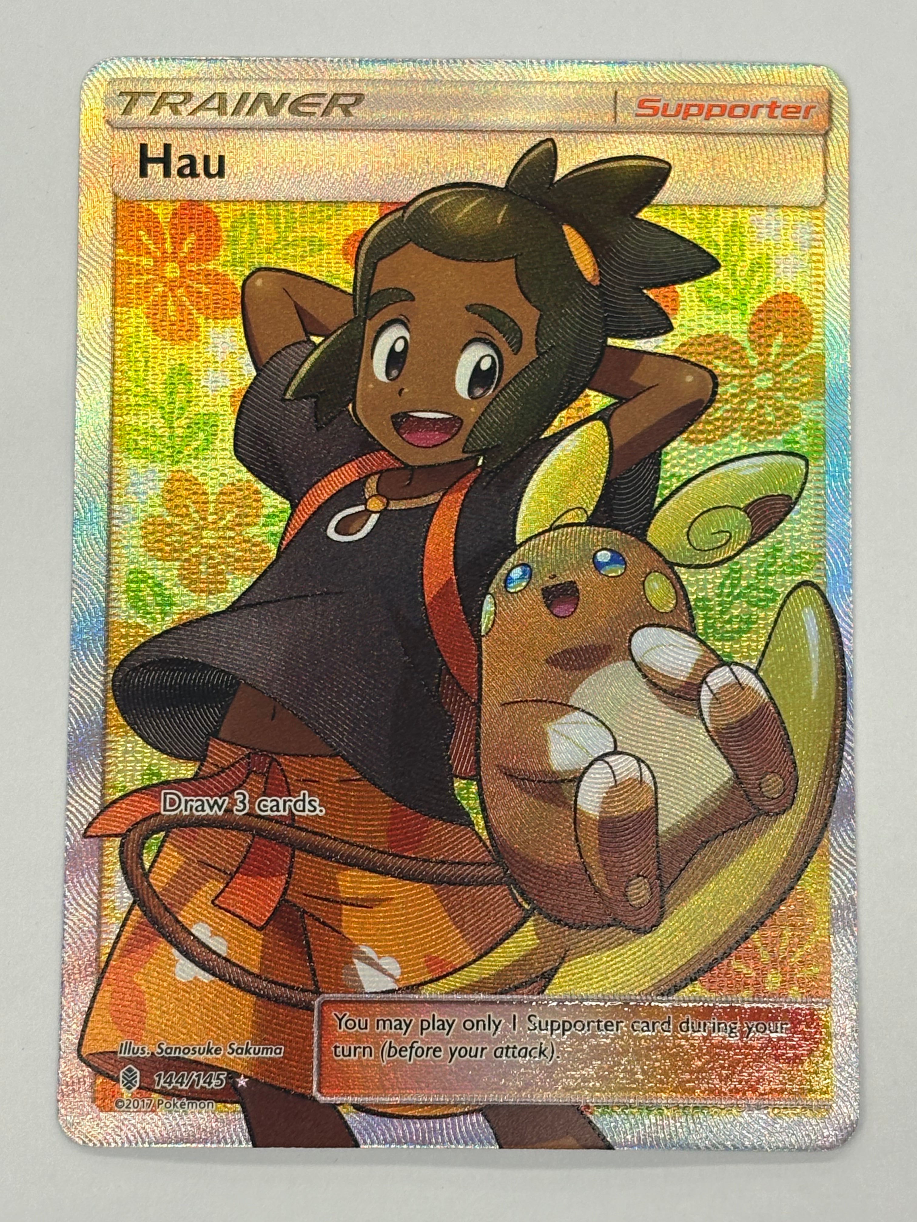 Pokémon TCG - Guardians Rising Hau 144/145 NM